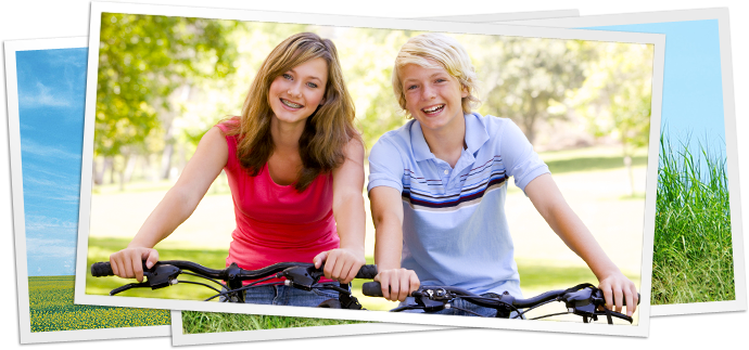 photo of boy and girl on bicycles